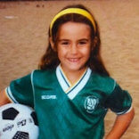 Young Semra holding a football in her native L.A.