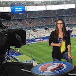Semra talking to camera in a studio inside the Stade de France in Paris for a preview of the 2016 European Championship in France
